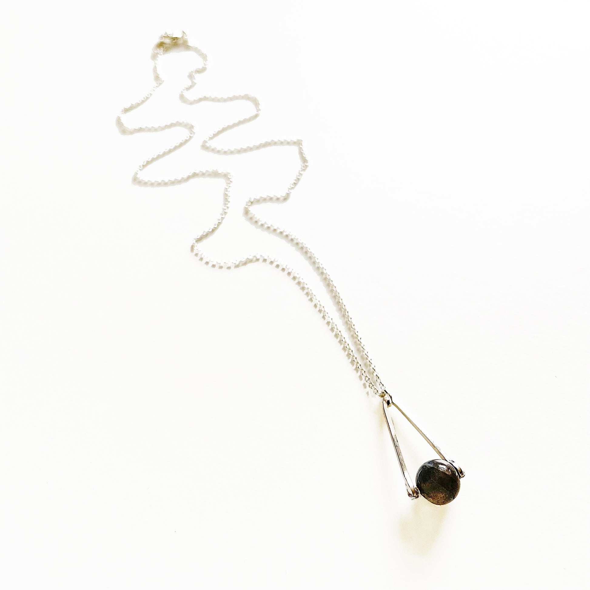 Labradorite round in green gray with flashing blue, sterling silver elongated triangle shape, sterling silver chain short necklace on white background
