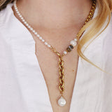 The Aletta Necklace by Third & Co. Studio: fresh water pearl, vintage gold-toned chain, mother of pearl and labradorite, create this adjustable length, wear-two-ways necklace. Can also be worn as a bracelet by wrapping around the wrist. Necklace shown on a model, at the shortest adjustable lariant length