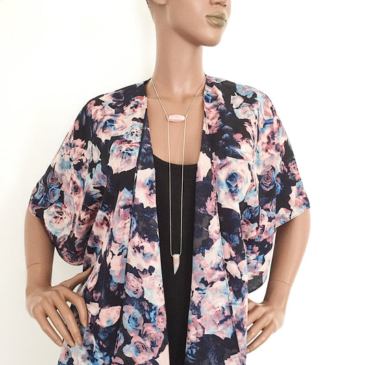 mannequin wearing the Binary Necklace by Third & Co. Studio: Agate "tooth" and tube shape in cream peach mauve orange, minimalist design with Sterling Silver snake chain lariat style long length, shown against a white background