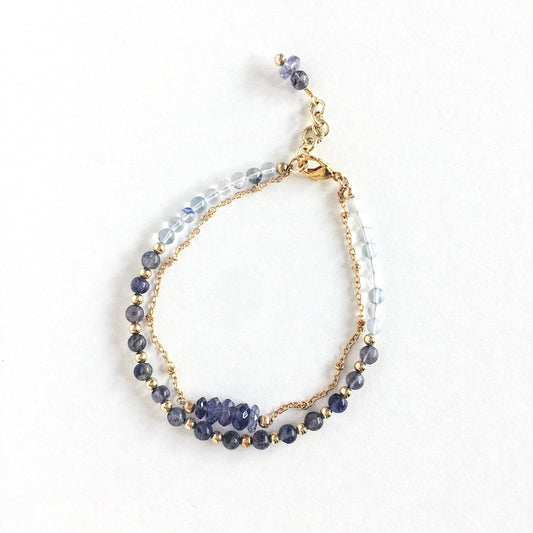 Andromeda Bracelet by Third & Co. Studio; faceted Iolite, round Quartz and Iolite, gold plated satellite chain adjustable length bracelet with lobster claw clasp, shown against a white background