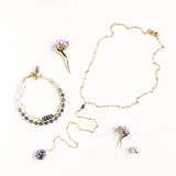 Andromeda Bracelet by Third & Co. Studio; faceted blue Iolite, round clear and blue Quartz and Iolite, gold plated satellite chain adjustable length bracelet with lobster claw clasp, shown against a white background as a matching set with the Andromeda Necklace