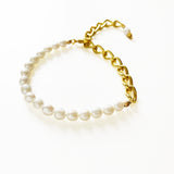 Aletta Bracelet from Third & Co. Studio with white fresh water pearl, gold plated vintage chain with adjustable length against a white background