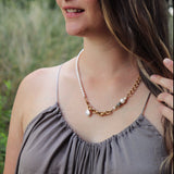 The Aletta Necklace by Third & Co. Studio: fresh water pearl, vintage gold-toned chain, mother of pearl and labradorite, create this adjustable length, wear-two-ways necklace. Can also be worn as a bracelet by wrapping around the wrist. Necklace pictured on a model at longest adjustable length