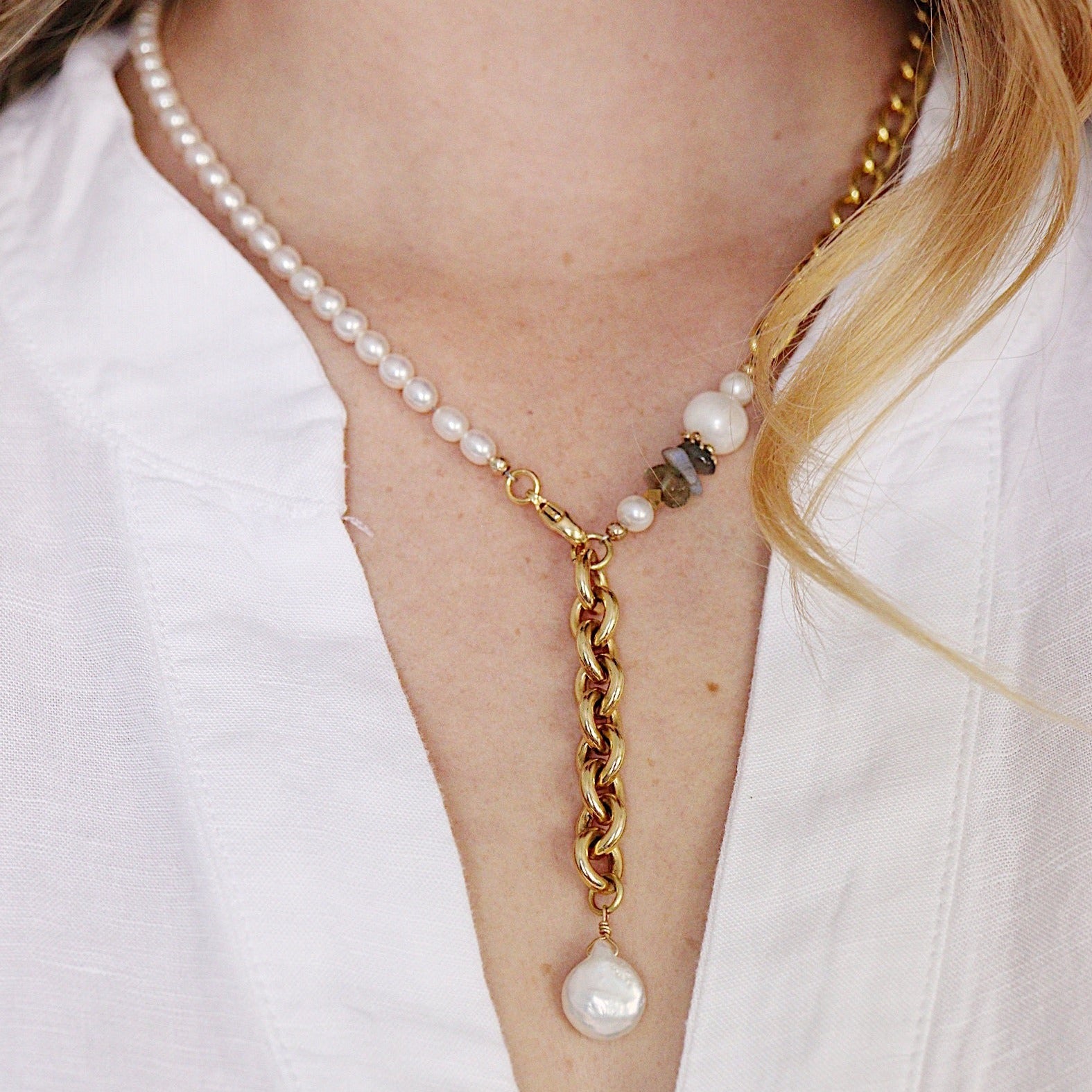 The Aletta Necklace by Third & Co. Studio: fresh water pearl, vintage gold-toned chain, mother of pearl and labradorite, create this adjustable length, wear-two-ways necklace. Can also be worn as a bracelet by wrapping around the wrist. Necklace shown on a model, at the shortest adjustable lariant length